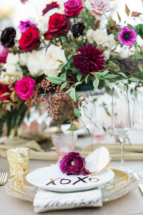 Los angeles valentine theme wedding shoot at the gardens at los robles vintage red and white lounge furniture with table and flower deocr and white and gold place settings with gold silverware