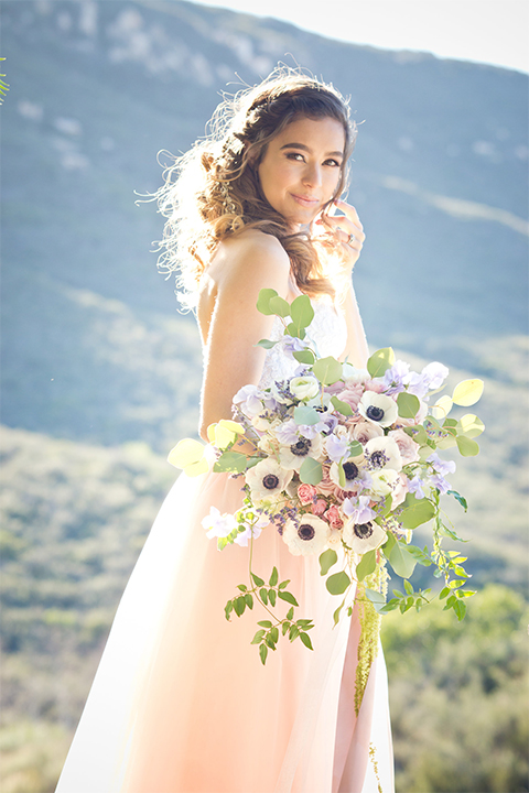 San diego outdoor woodland wedding shoot bride blush pink chiffon strapless gown with a sweetheart neckline holding white floral bridal bouquet